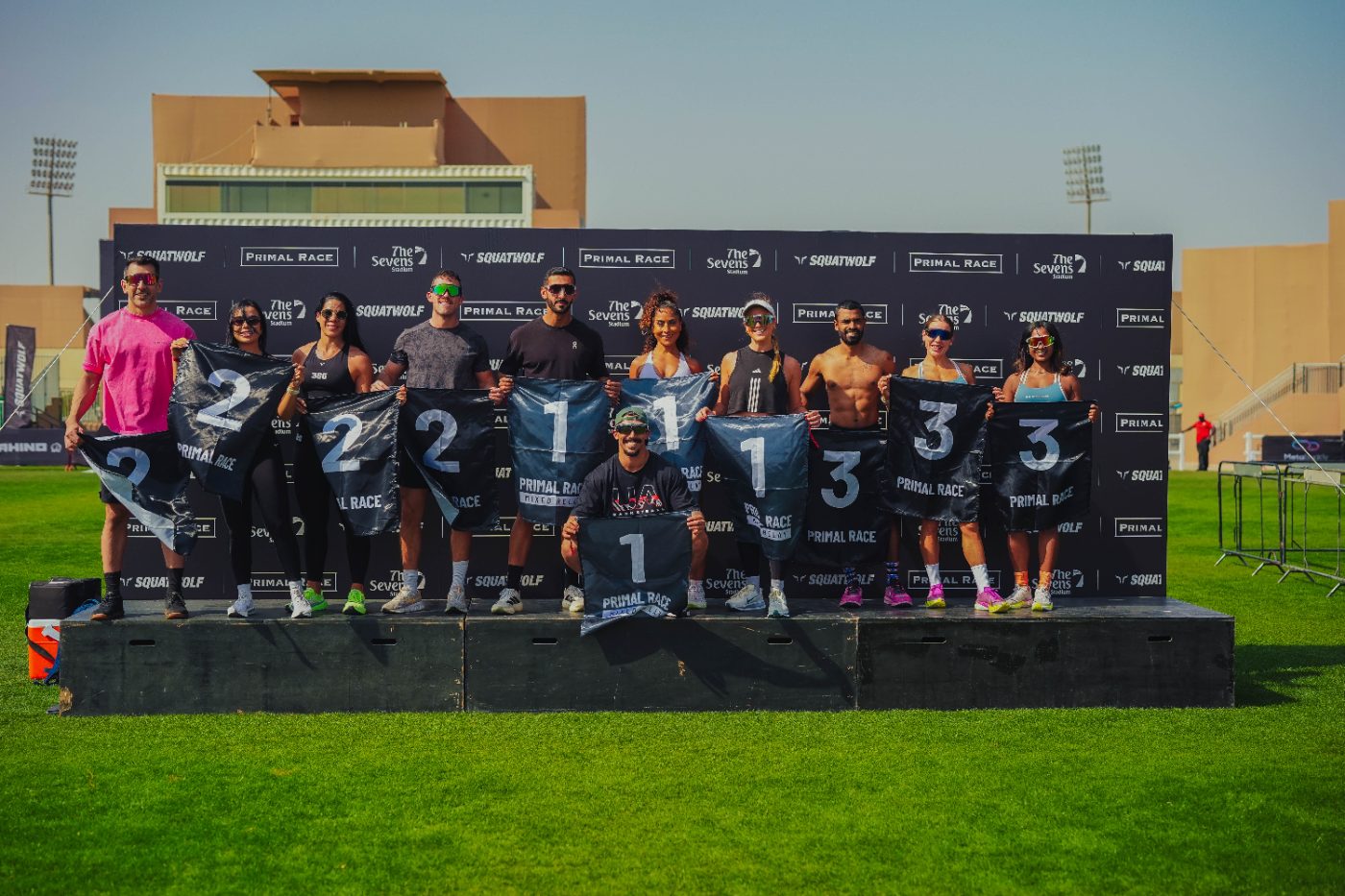 Athletes lined up behind their bib boards at a Primal race