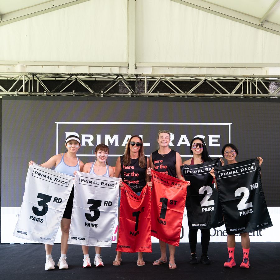 The pairs podium with their placards