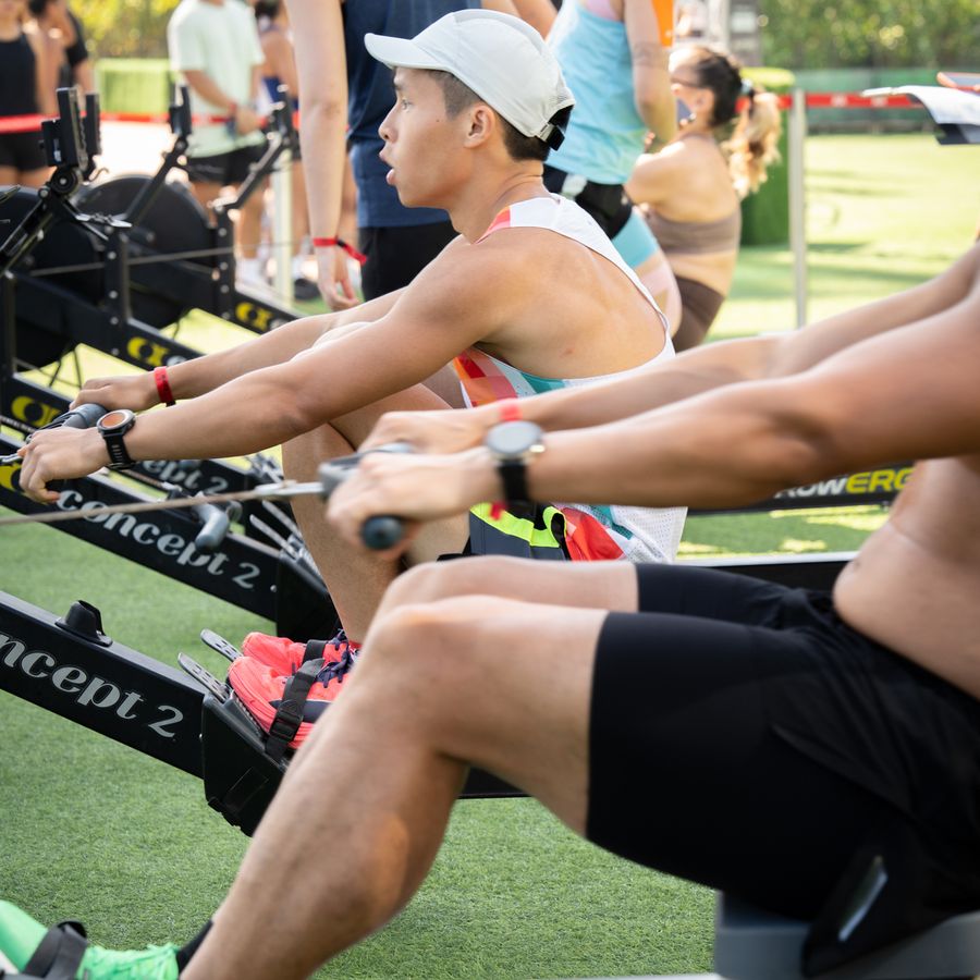 An athlete driving through a rowing stroke