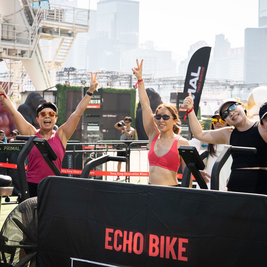 Athletes cheering the echo bikes on